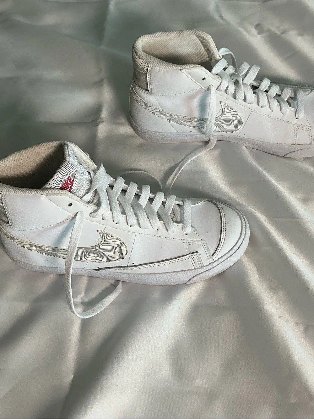 Nike White High-Top Sneakers with Red Logo